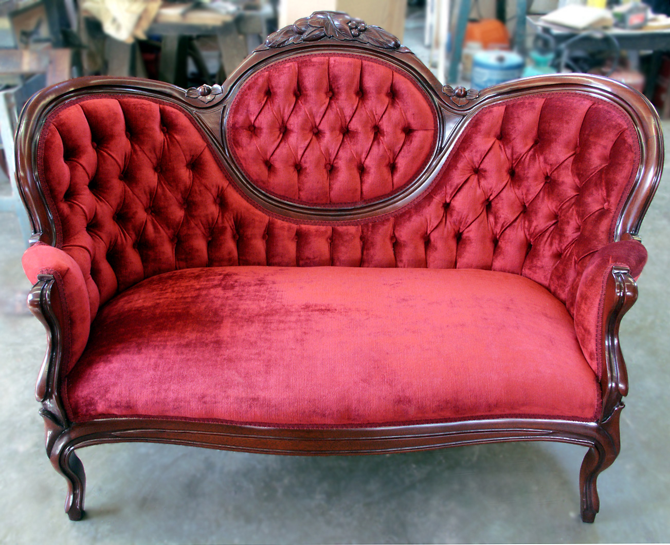 Red velvet tufted settee