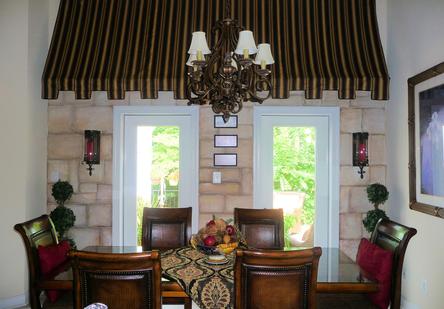 Striped valance over a dining room window