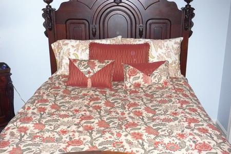Made bed with floral bedding